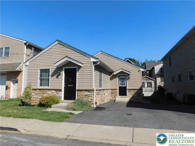a front view of a house with garage