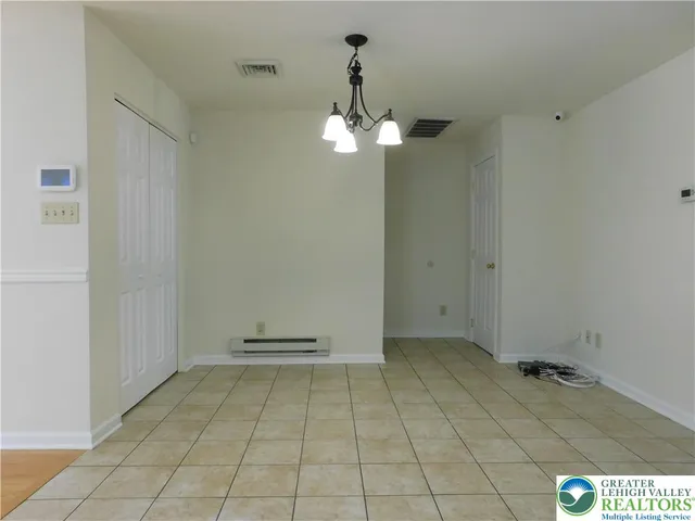 a view of a storage & utility room with a sink