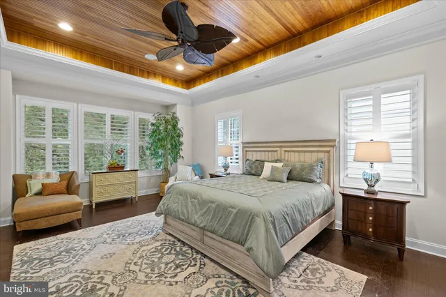 a bathroom with a granite countertop sink and a window