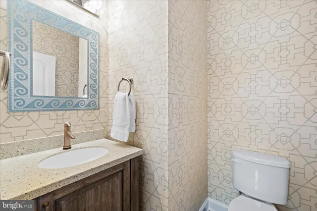 a picture of a bench in front of a building