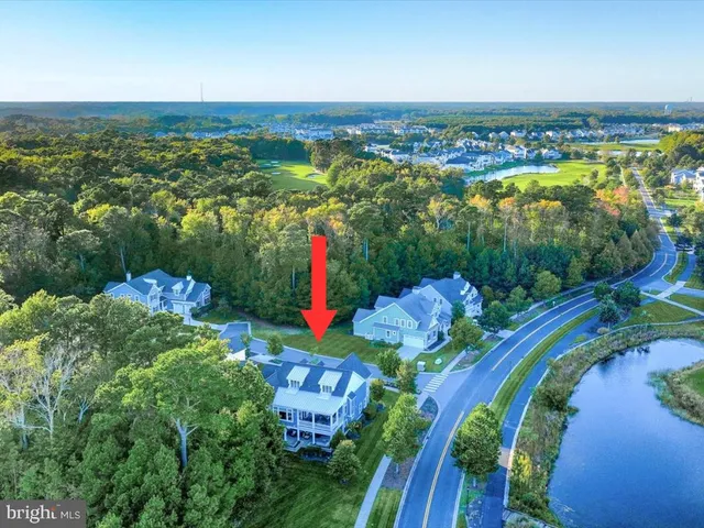 a dining room with furniture a rug and a large window