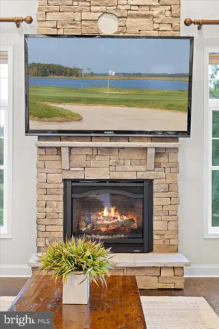 a dining room with furniture and a chandelier