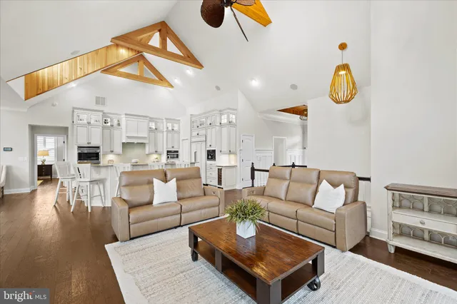 a bedroom with a large bed couch and a window