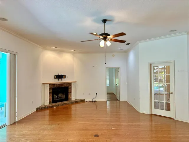 a kitchen with a table chairs refrigerator and microwave