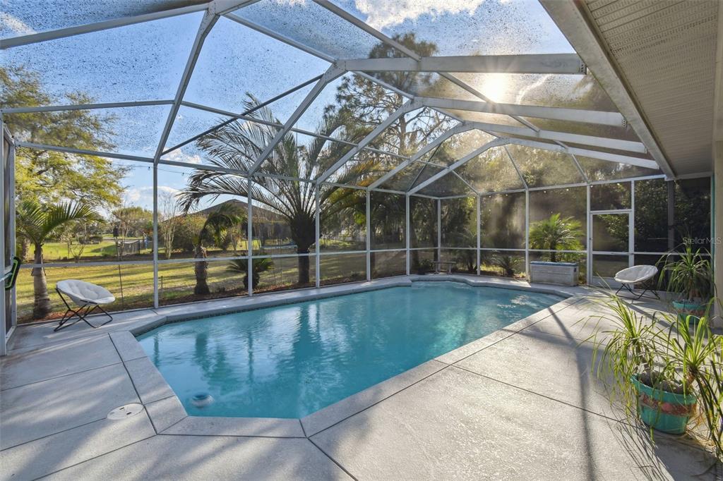 5261 Waterwood Drive Bartow, FL 33830 - Photo 2 of 72 a view of a swimming pool with a patio and a yard