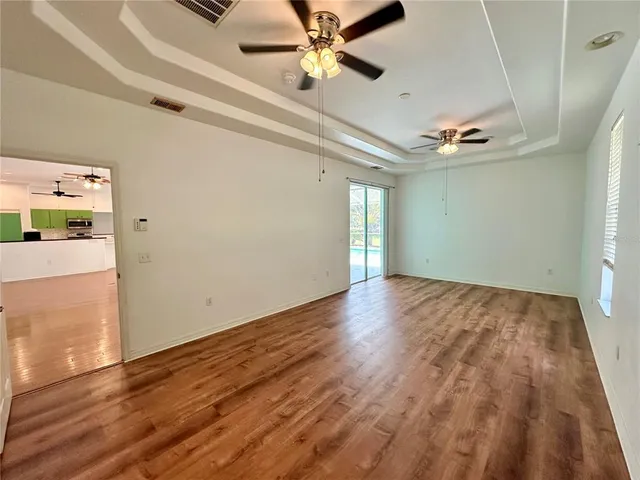 a view of a porch with a table and chairs