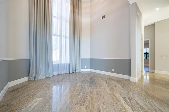 a large kitchen with stainless steel appliances granite countertop a stove and a sink