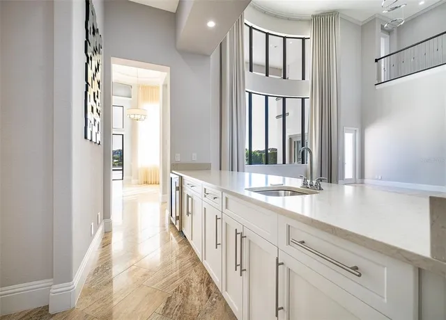 a kitchen with stainless steel appliances a refrigerator sink and cabinets