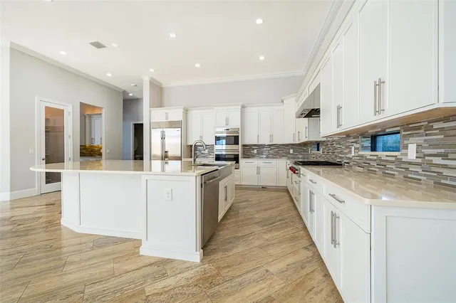 a view of a living room with a rug floor and a floor to ceiling window