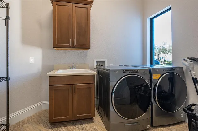 a bathroom with a shower and a glass door