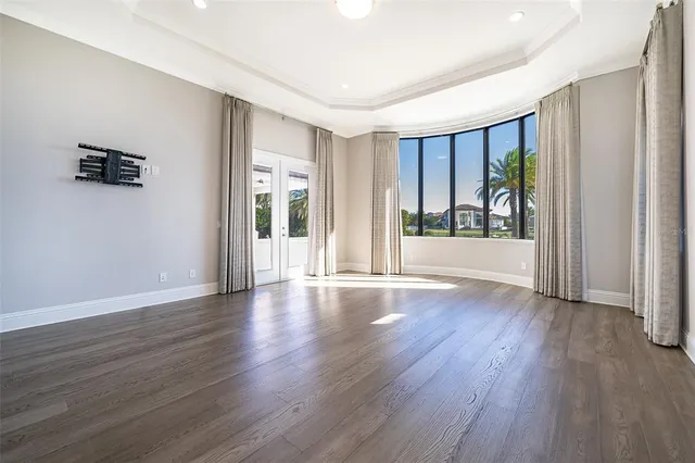 a spacious bathroom with a granite countertop tub sink and mirror