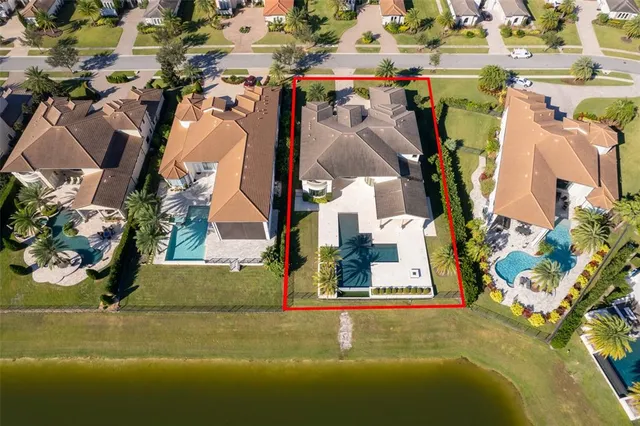 an aerial view of a house with swimming pool