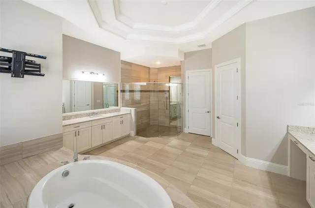a bathroom with a granite countertop sink toilet a mirror and shower