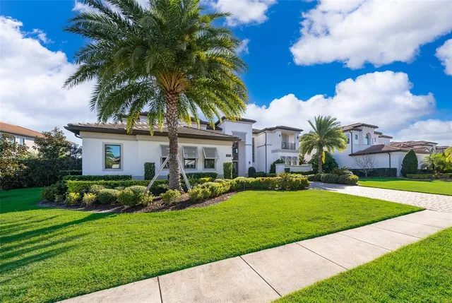 a view of staircase with lots of frames on wall and wooden floor