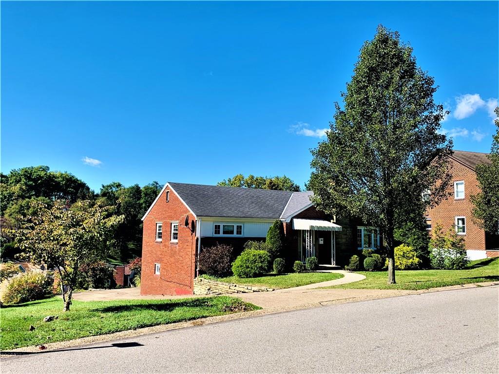 4776 Rolling Hills Road Pittsburgh, PA 15236 - Photo 2 of 25 The level entry brick ranch is bordered to the left by the Baldwin Manor green space, giving a sense of a park like expansive yard without the need to cut the grass and maintain it.
