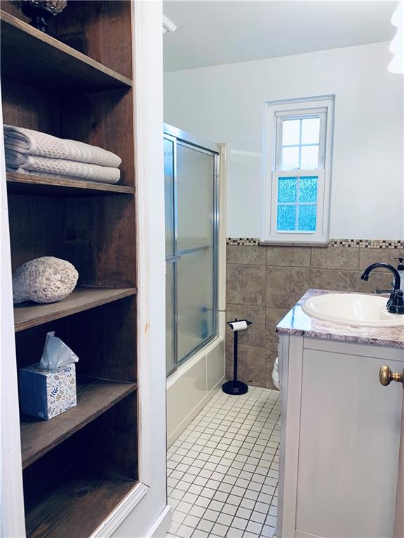 4776 Rolling Hills Road Pittsburgh, PA 15236 - Photo 23 of 25 The hall bathroom was remodeled and has large open linen shelves.