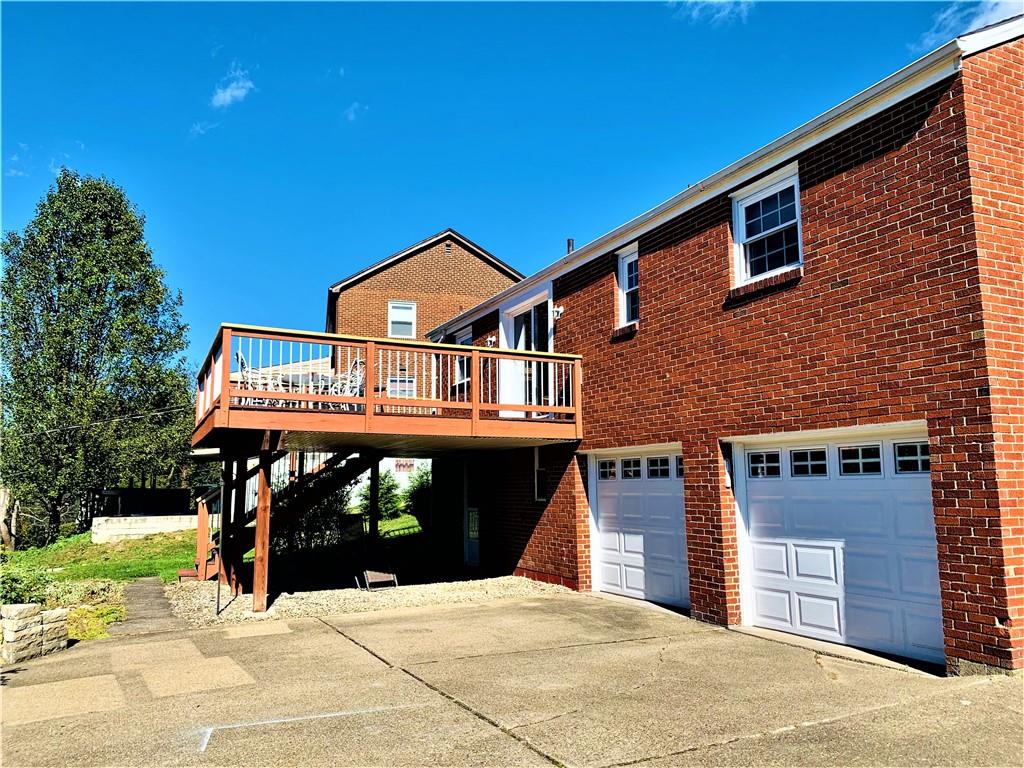 4776 Rolling Hills Road Pittsburgh, PA 15236 - Photo 25 of 25 The rear entry 2 car garage,16x16 deck,gravel patio beneath, large concrete turnaround and long driveway can accommodate large gatherings with many vehicles.