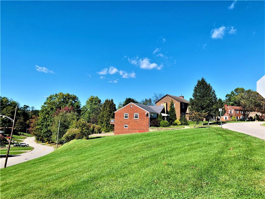 4776 Rolling Hills Road Pittsburgh, PA 15236 - Photo 3 of 25 Here is the bordering green space that abuts the lot. Doverdell Rd leading to Caste Village is to the lower left.