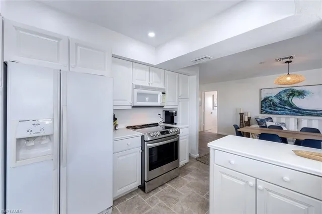 a kitchen with a stove and a refrigerator