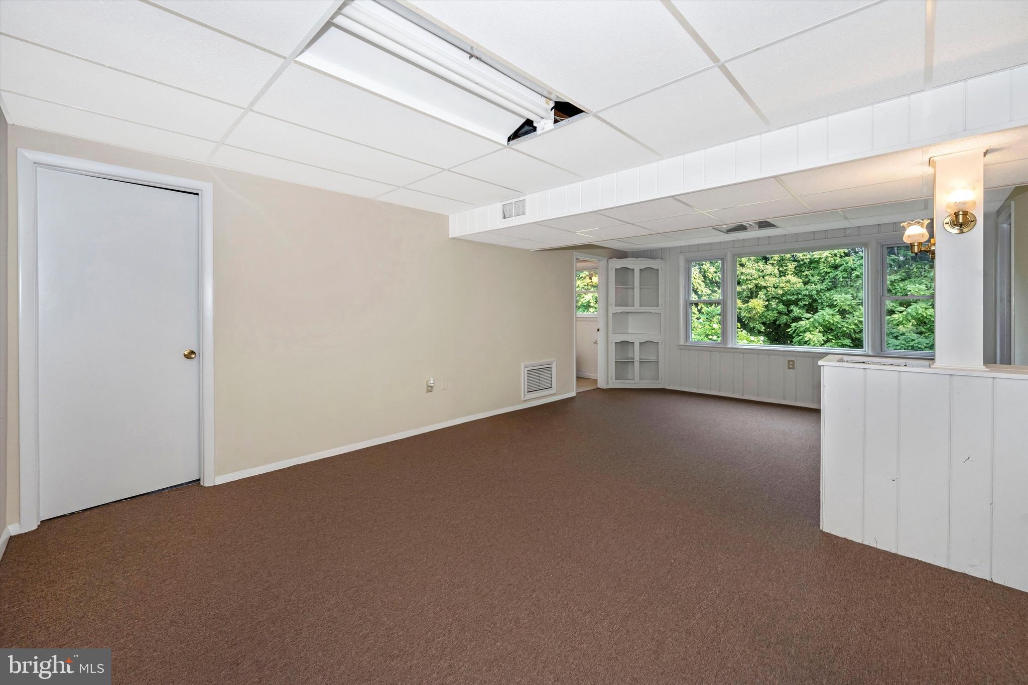 13530 Penn Shop Road Mount Airy, MD 21771 - Photo 22 of 31 Lower Level Family Room with Door to Garage