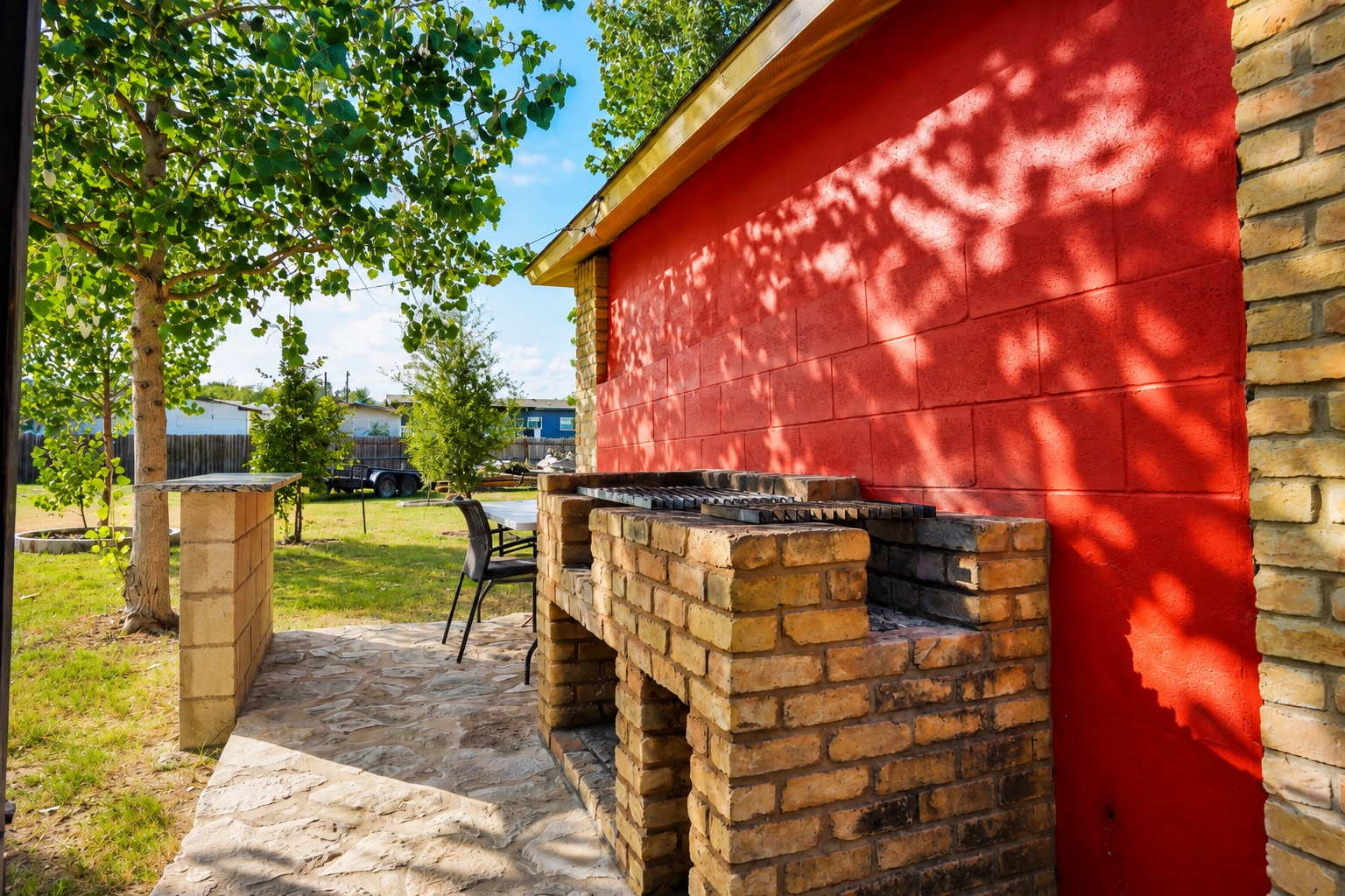 158 Buena Fortuna Road Elgin, TX 78621 - Photo 28 of 40 A built-in barbecue area on a stone patio provides an ideal setting for outdoor entertaining.