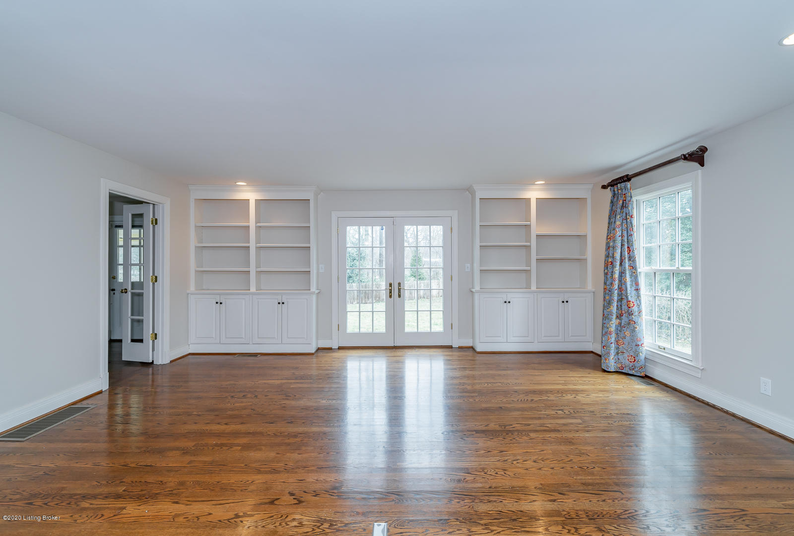 3036 Lexington Road Louisville, KY 40206 - Photo 12 of 43 Built-in bookshelves and outlet in the floor allow a sofa and end tables to be positioned to float in the middle of the room.