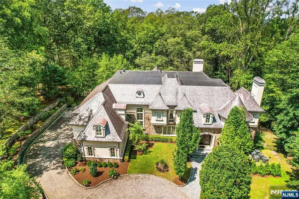 an aerial view of a house with a garden