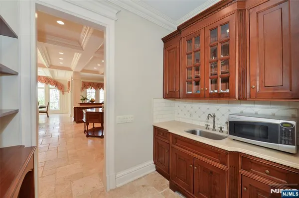 a kitchen with a sink cabinets and appliances