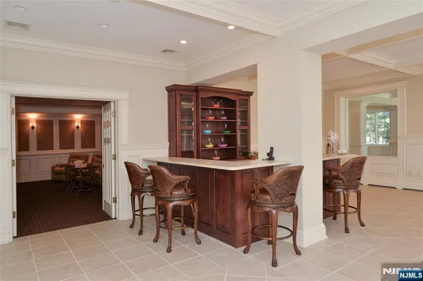 a dining room with a table and chairs