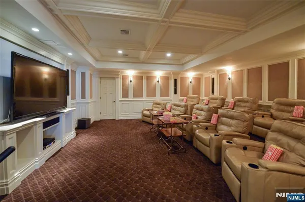 a living room with lots of furniture and a flat screen tv