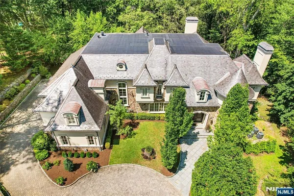 an aerial view of a house with a garden and plants