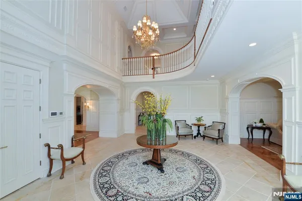 a living room with chandelier furniture and a chandelier