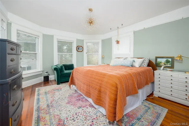 a bed room with a bed window and dresser