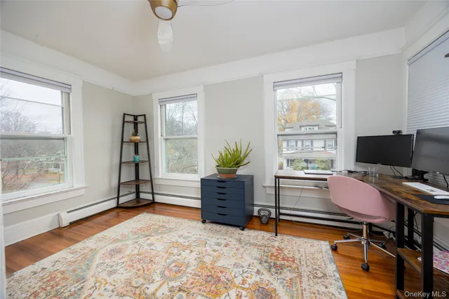 a workspace with furniture and window