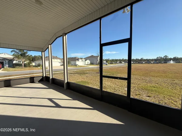 a picture of a floor to ceiling window with an outdoor view