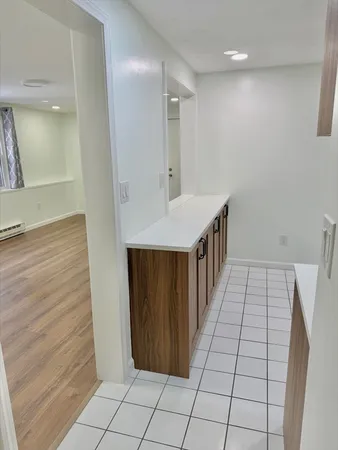 a bathroom with a sink a mirror and shower