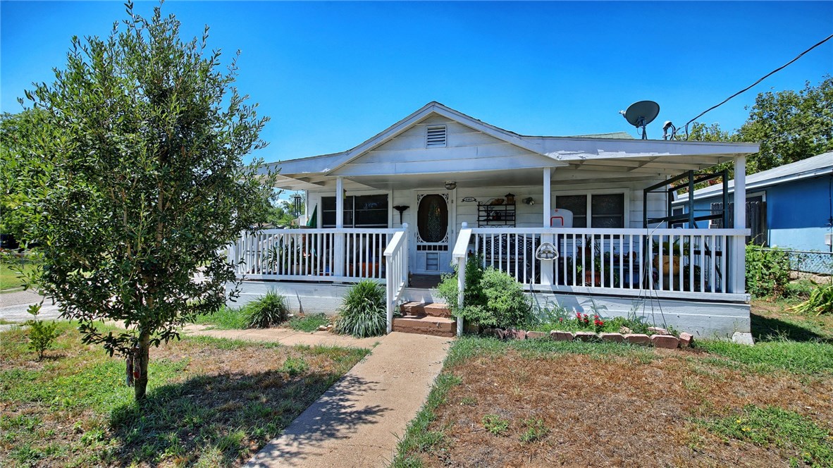 6405 Torres Street Austin, TX 78741 - Photo 1 of 1 front view of a house with a yard