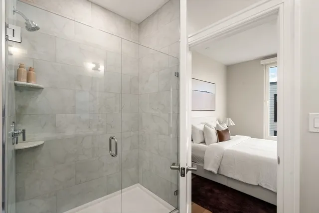 a bathroom with a bathtub and shower