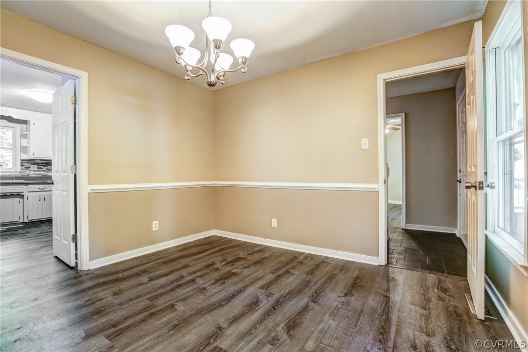 7519 Barkbridge Road Chesterfield, VA 23832 - Photo 17 of 40 wooden floor in an empty room with a window