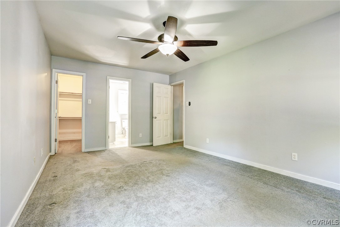 7519 Barkbridge Road Chesterfield, VA 23832 - Photo 20 of 40 an empty room with chandelier fan and windows