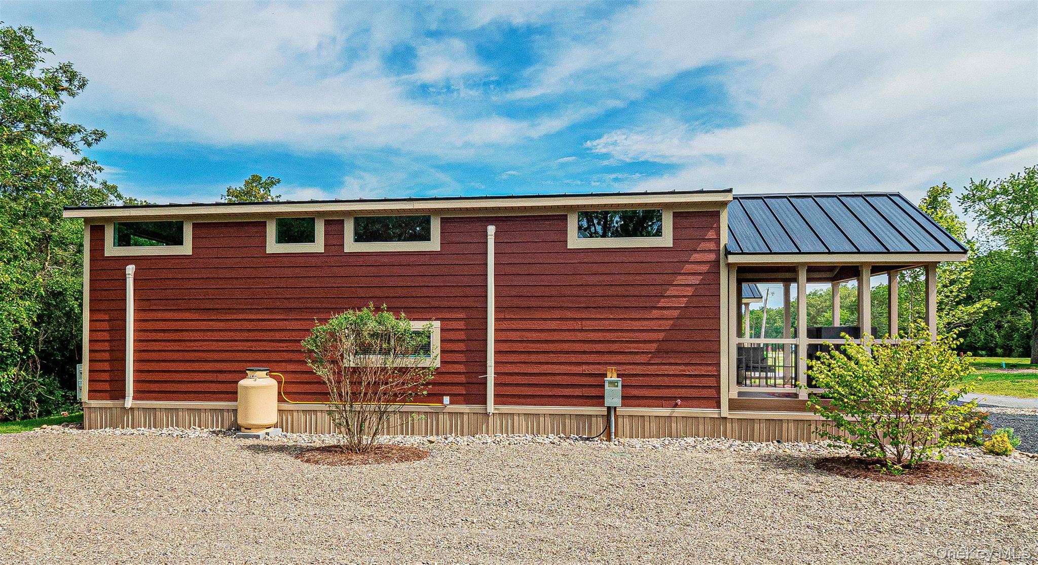 197 Wheeler Road, Unit 101 Florida, NY 10921 - Photo 17 of 41 View of home's exterior featuring a metal roof