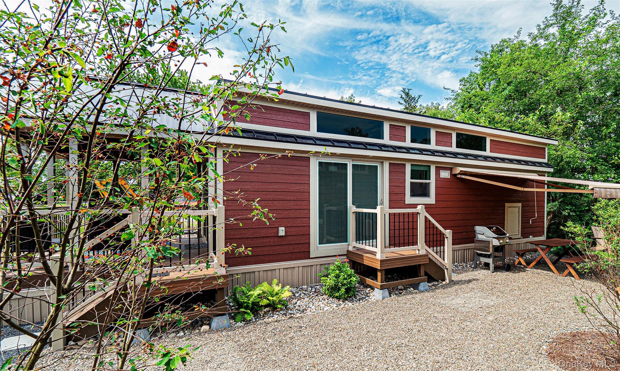197 Wheeler Road, Unit 101 Florida, NY 10921 - Photo 18 of 41 Side view of property featuring a metal roof and a wooden deck