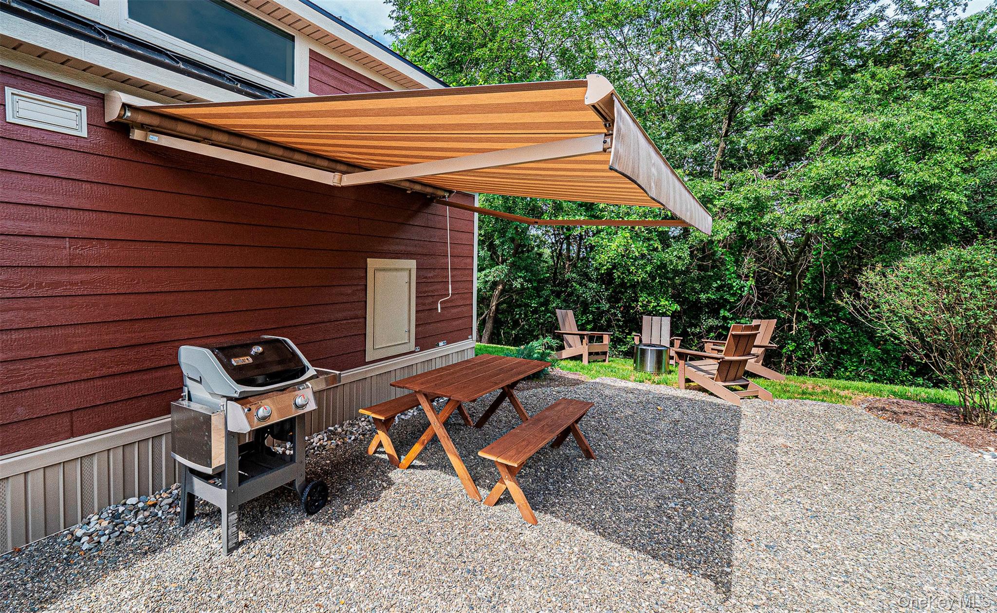 197 Wheeler Road, Unit 101 Florida, NY 10921 - Photo 19 of 41 View of patio area with space to grill, and a picnic table, and awning.