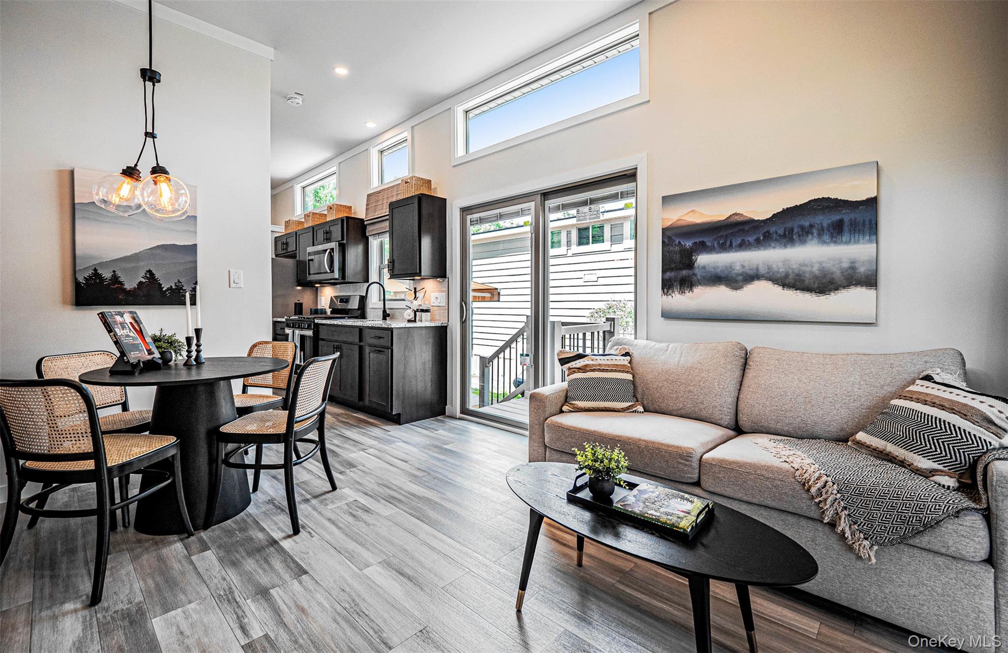 197 Wheeler Road, Unit 101 Florida, NY 10921 - Photo 5 of 41 Living area with light wood-type flooring, recessed lighting, and a towering ceiling