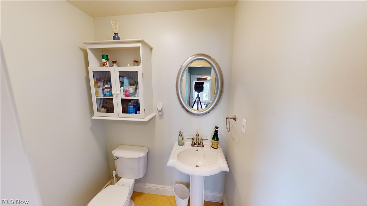 290 McIntosh Road Chester, WV 26034 - Photo 15 of 43 Bathroom with tile patterned floors and toilet