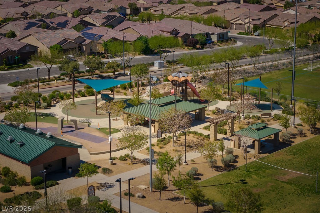 3069 Scenic Rhyme Avenue Henderson, NV 89044 - Photo 25 of 29 The community park features a full children's play structure, a splash pad area, shaded pavilions, and landscaped walking paths — all HOA-maintained. For families with kids, this is a daily amenity, not an occasional outing.