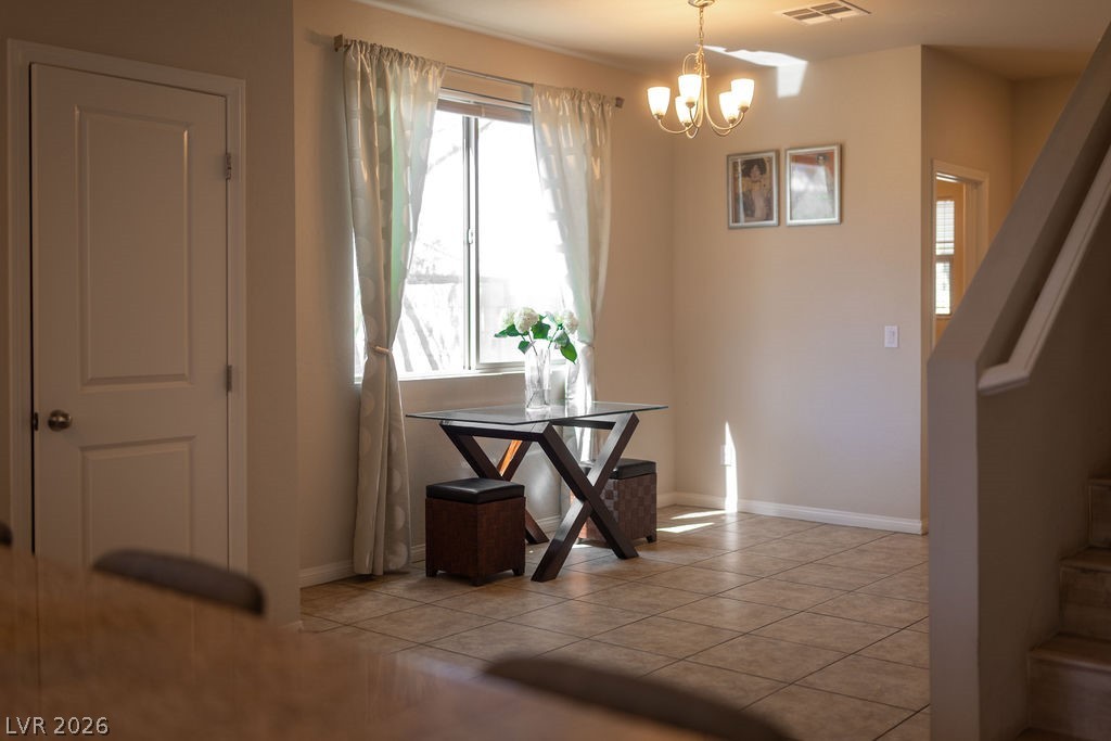 3069 Scenic Rhyme Avenue Henderson, NV 89044 - Photo 28 of 29 The large window floods the entry with natural light while the chandelier above anchors the space. From here you can see straight toward the back of the home — this floor plan has nothing to hide.