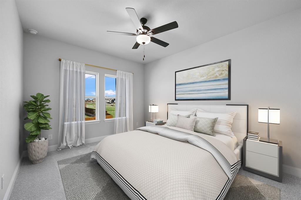 1612 Yellow Rose Road Celina, TX 75009 - Photo 17 of 40 a bedroom with a large bed and a window
