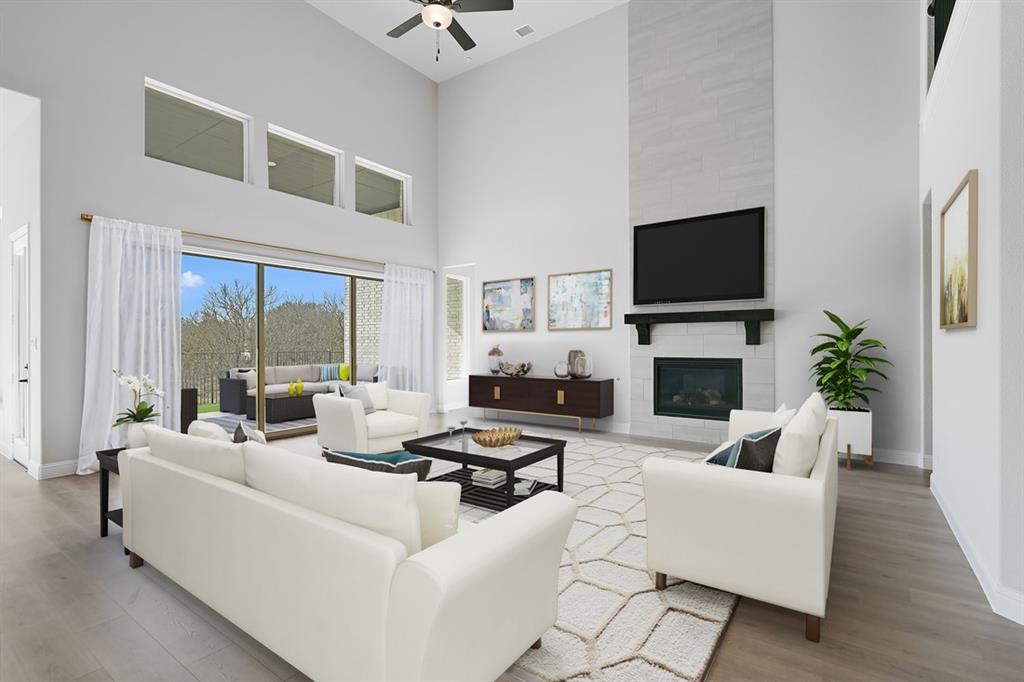 1612 Yellow Rose Road Celina, TX 75009 - Photo 5 of 40 a living room with furniture a flat screen tv and a large window