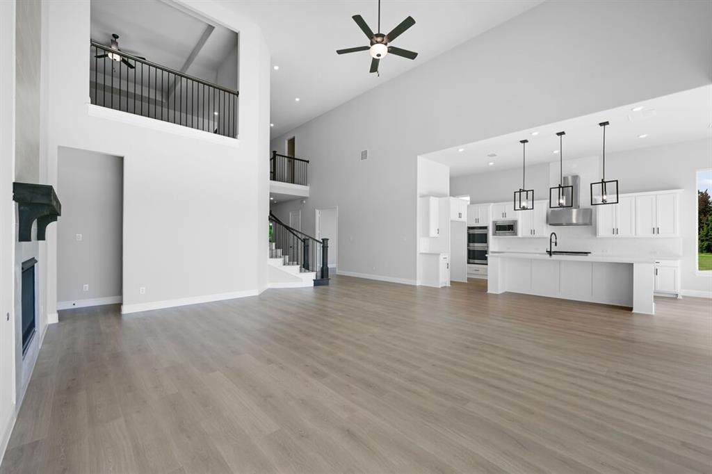 1612 Yellow Rose Road Celina, TX 75009 - Photo 7 of 40 a view of kitchen with furniture and wooden floor